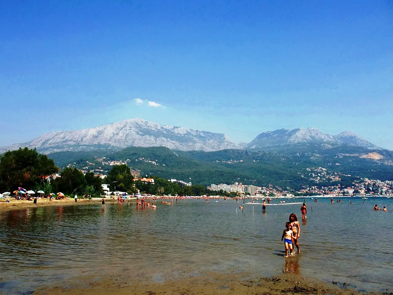 The waterfront at Igalo near Herceg Novi, with the Bay of Kotor and wooded hills behind