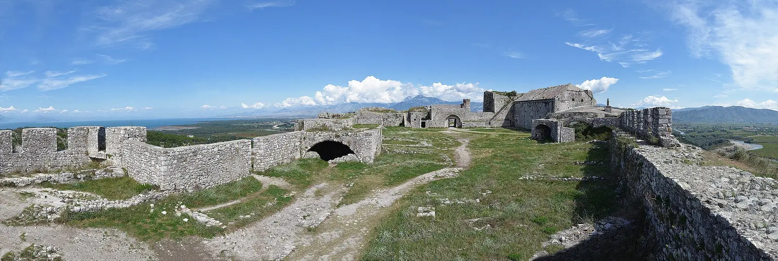 Panorama from inside Rozafa Castle above Shkoder, Albania, with stone ramparts and the plain beyond