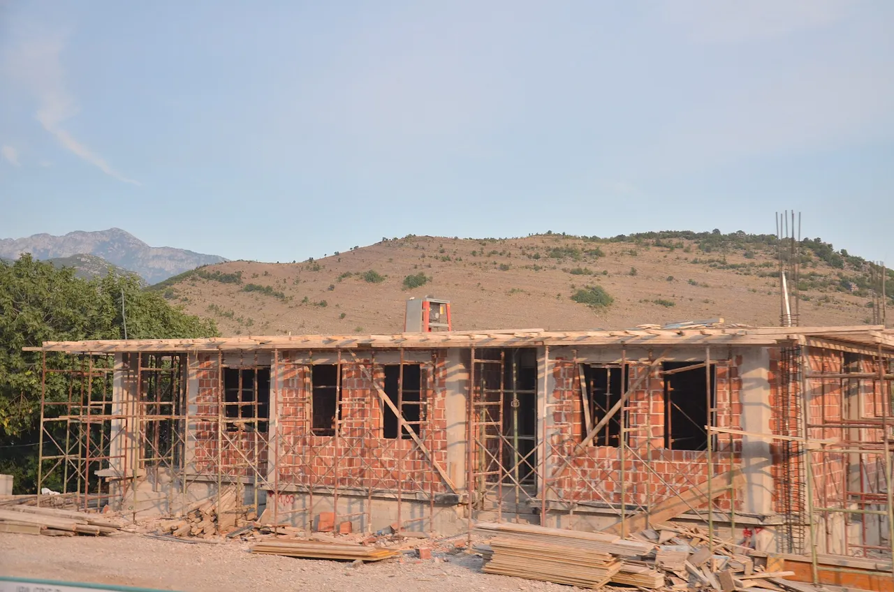 The Bozaj crossing between Montenegro and Albania with control booths and waiting vehicles