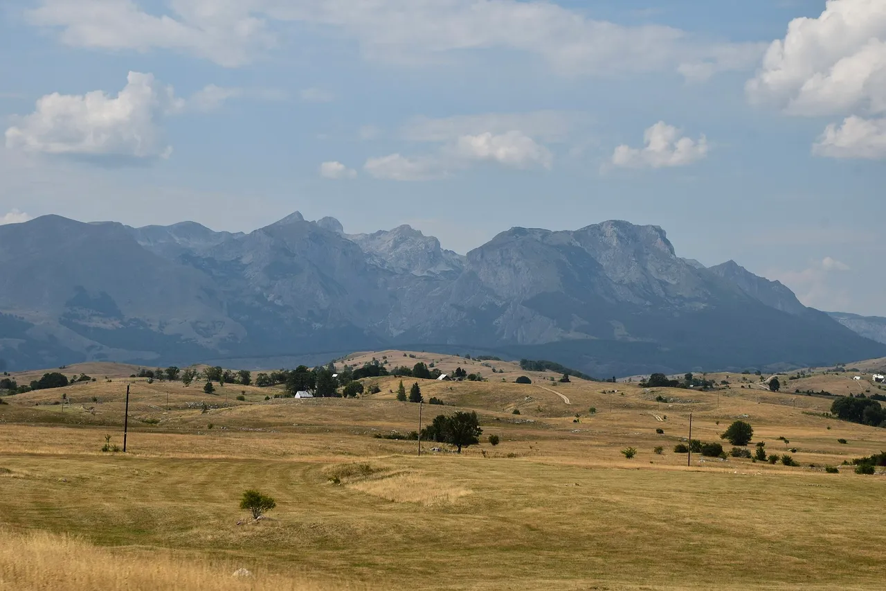 The Durmitor ring road curving through high limestone country