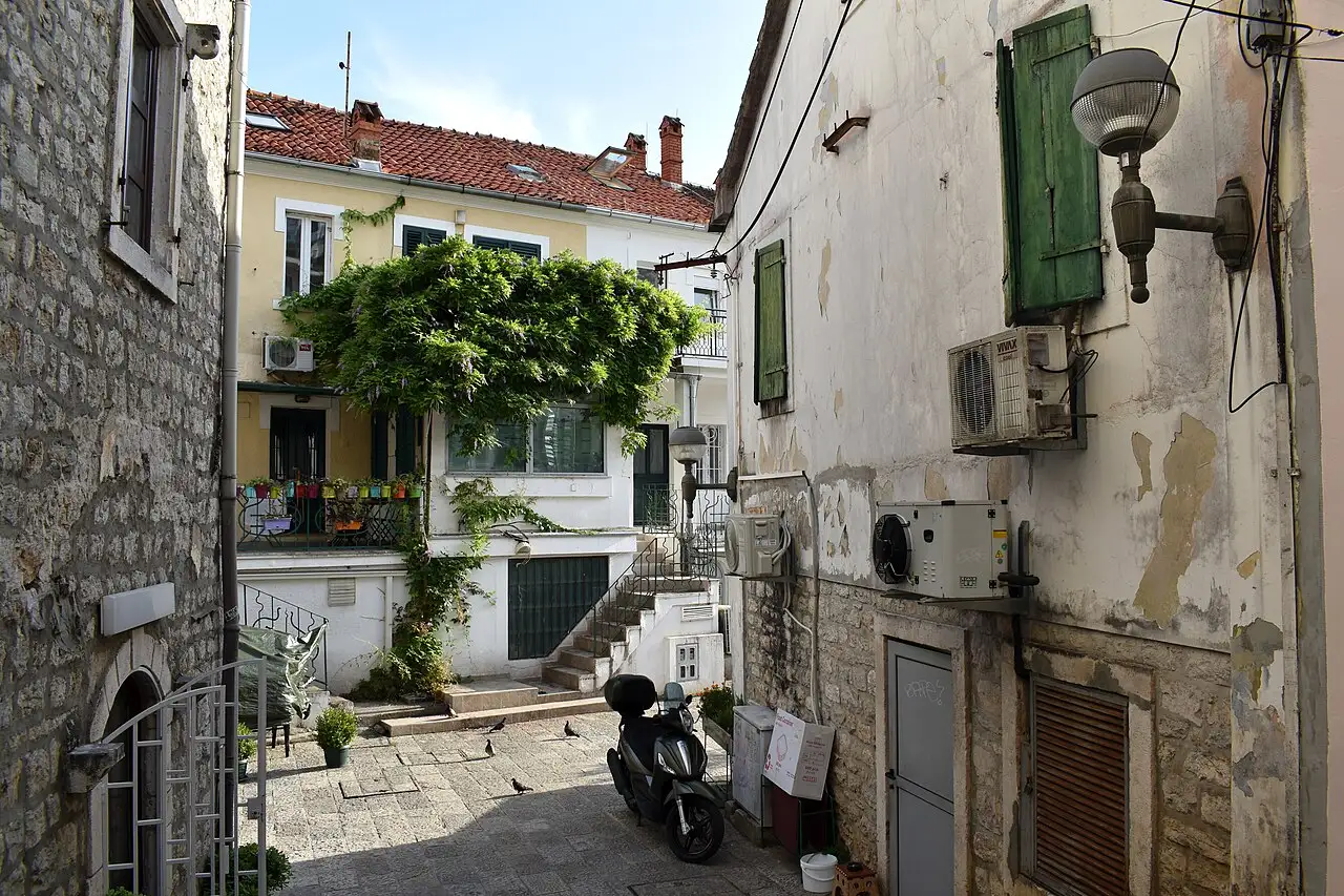 Boats and waterfront buildings along the Herceg Novi shore