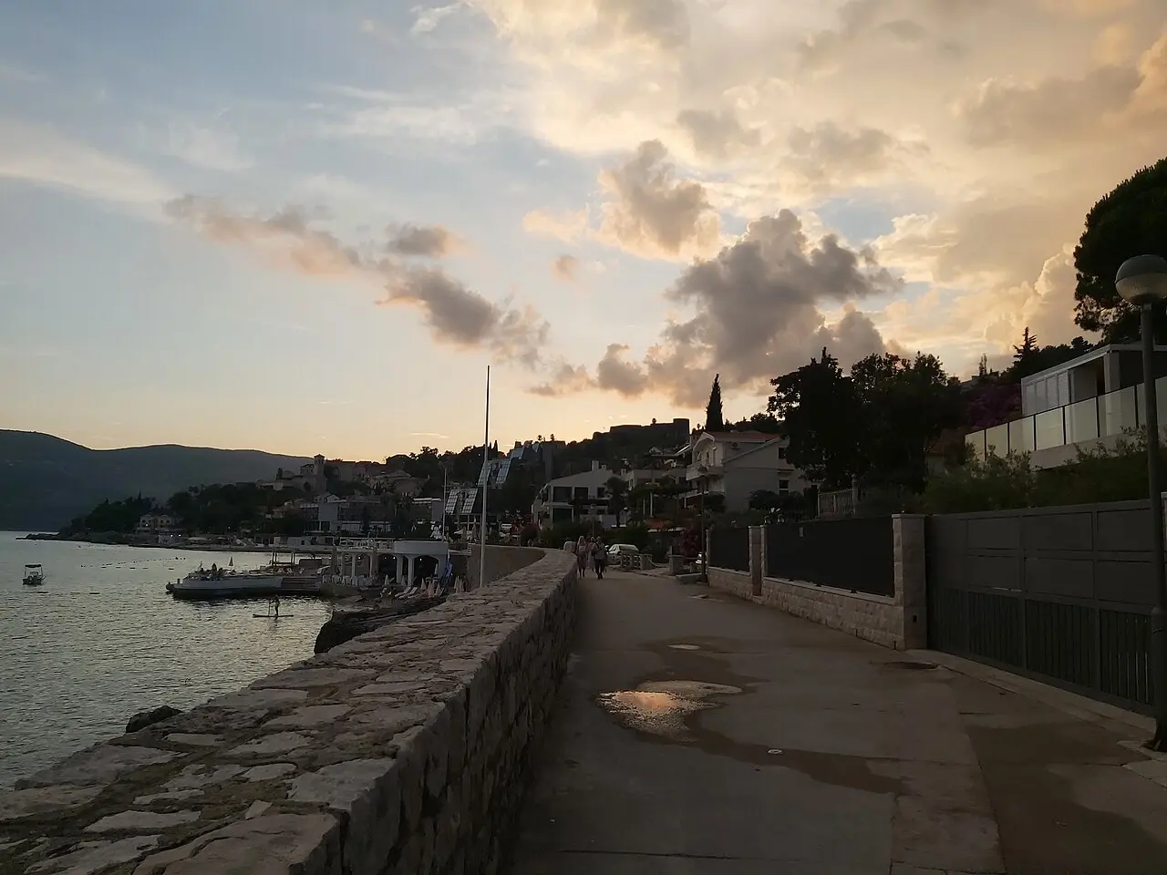 Palm-lined Pet Danica promenade in Herceg Novi with the bay beyond