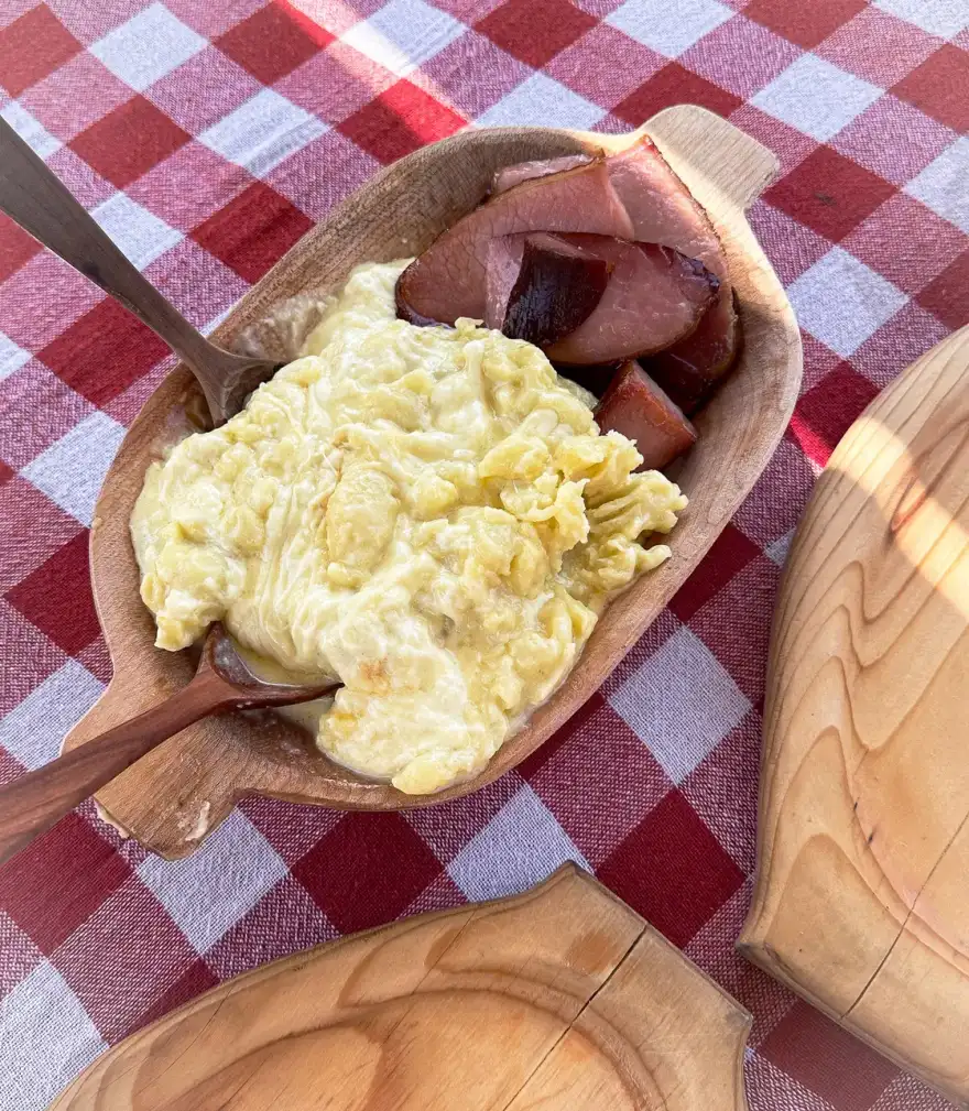 Bowl of Montenegrin kačamak cornmeal dish with cheese