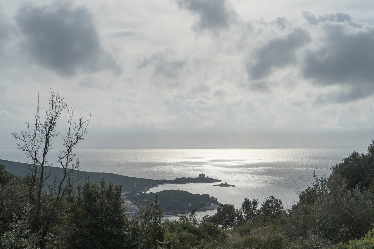 The rugged coastline of the Lustica peninsula meeting the deep blue Adriatic, Montenegro