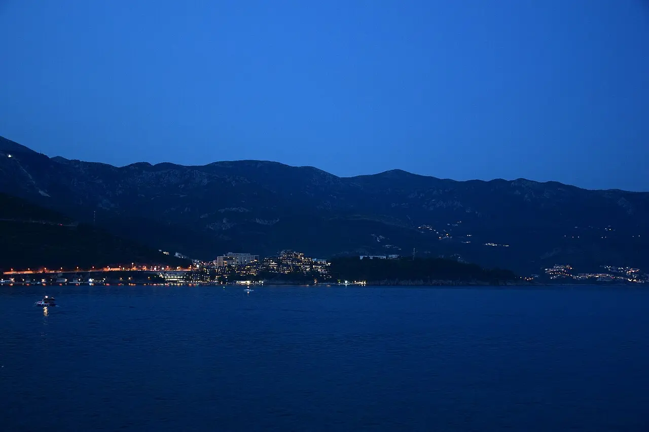 Budva seafront and harbour lights reflected in the Adriatic at night