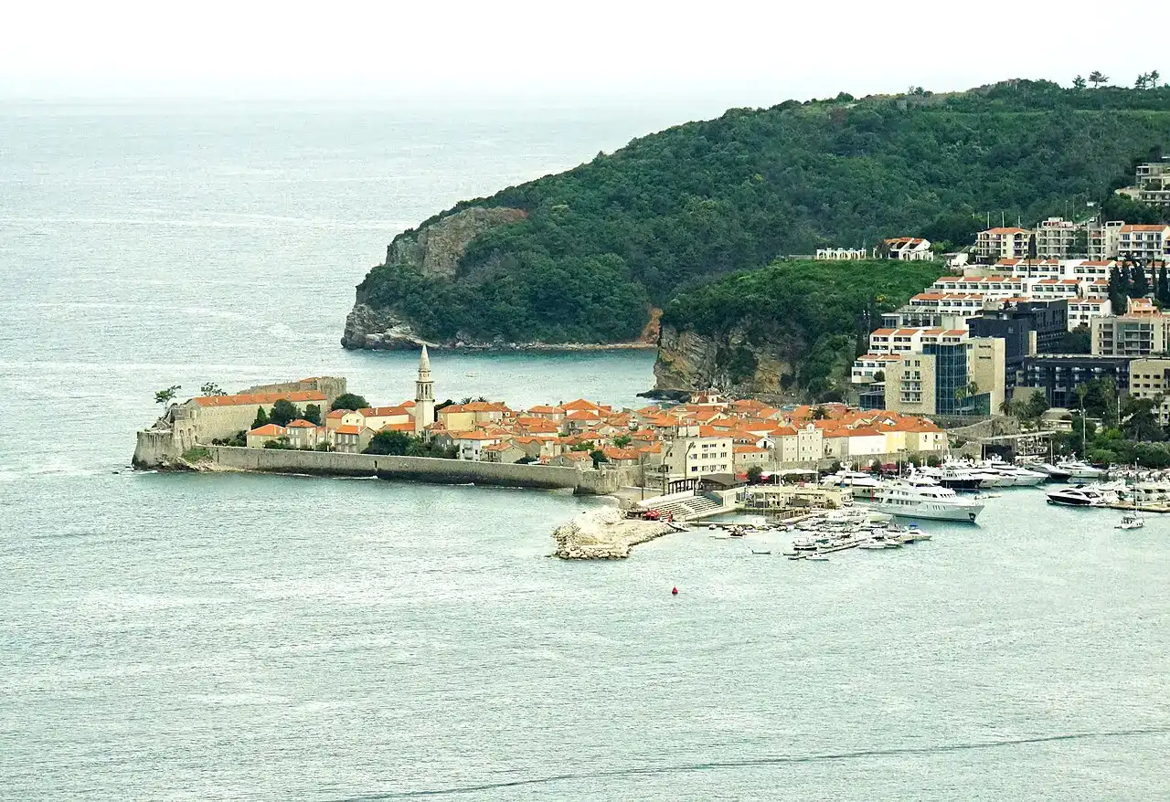 Aerial view of Budva Old Town on its peninsula with the marina and red rooftops