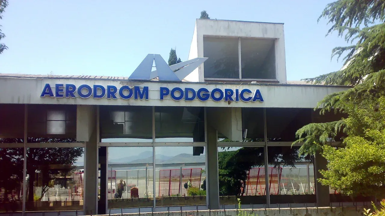 The terminal building and apron of Podgorica Airport (TGD) on the Zeta plain, Montenegro
