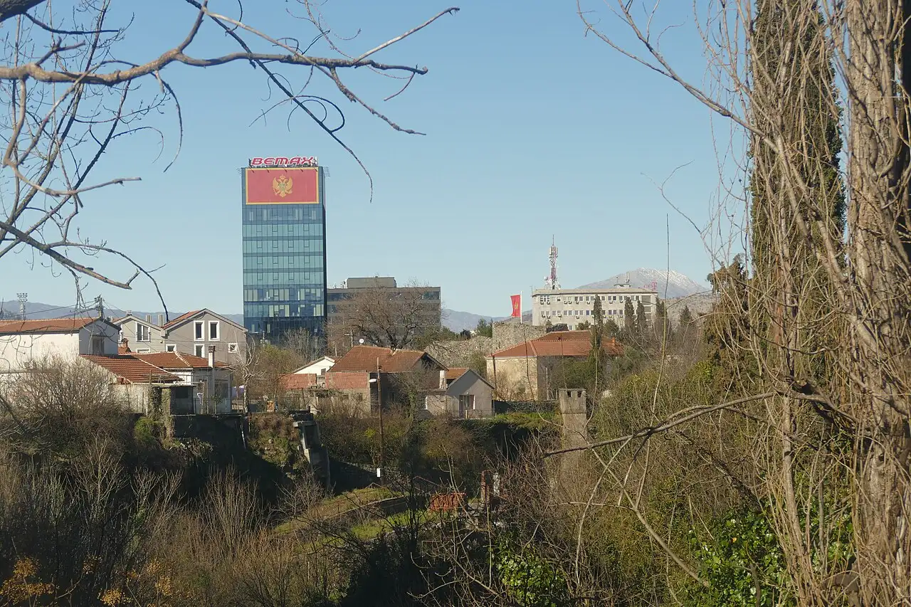 Rooftops and apartment blocks of Podgorica, the capital of Montenegro, with mountains behind
