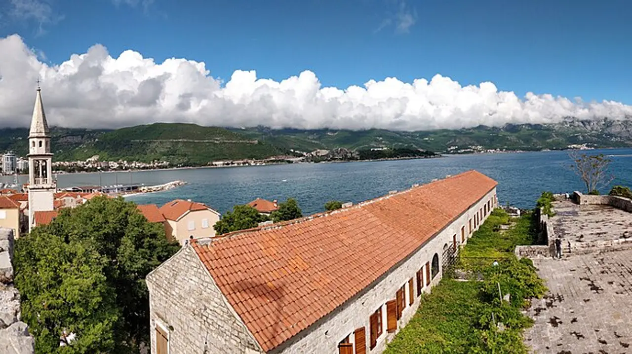 View from the Budva citadel over the old town roofs, the town beach and Sveti Nikola island