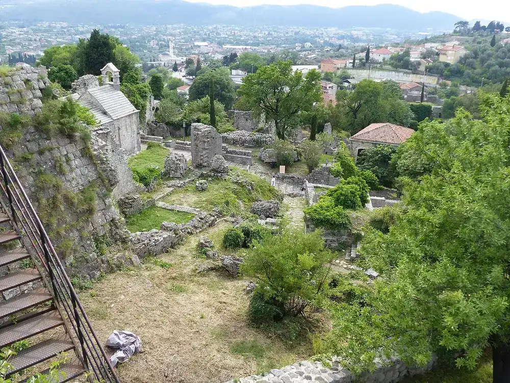 The ruined stone city of Stari Bar with roofless churches and the modern town below