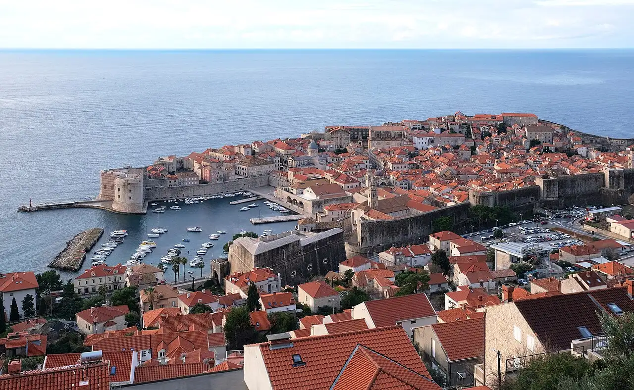 Terracotta roofs and harbour of Dubrovnik Old Town seen from above