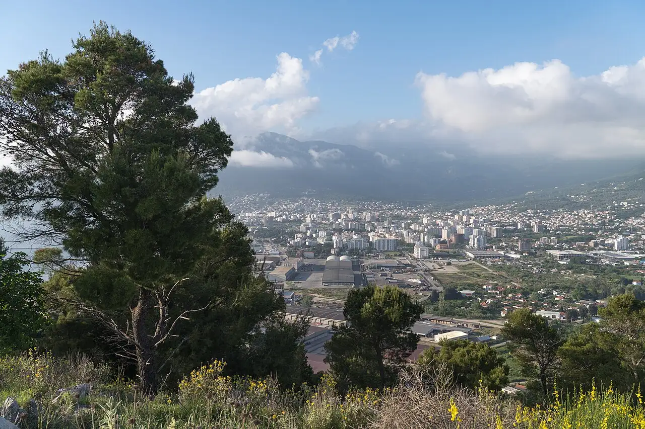 The town of Bar spread along the coast below Mount Rumija, seen from the Volujica headland