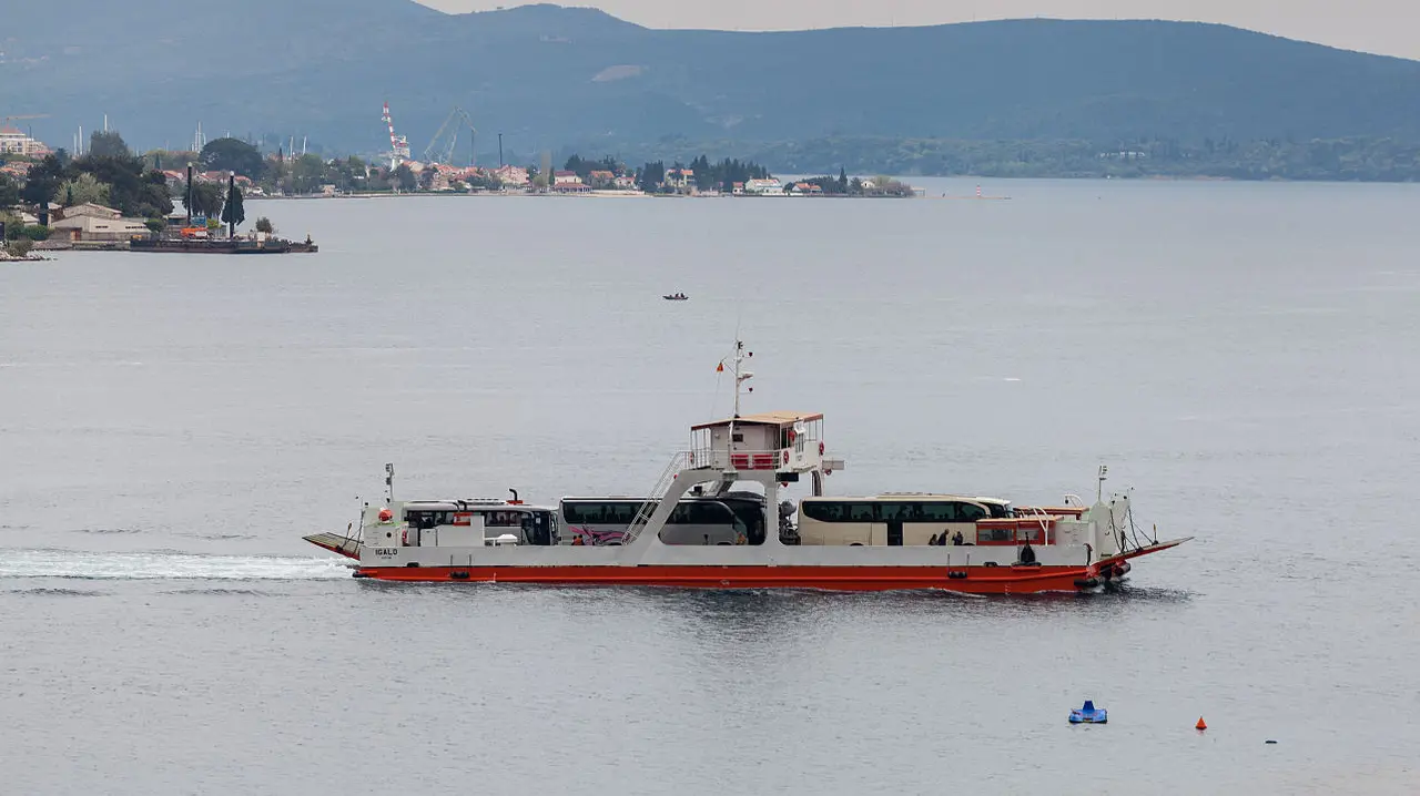 The Kamenari-Lepetane car ferry loaded with vehicles crossing the Bay of Kotor, Montenegro