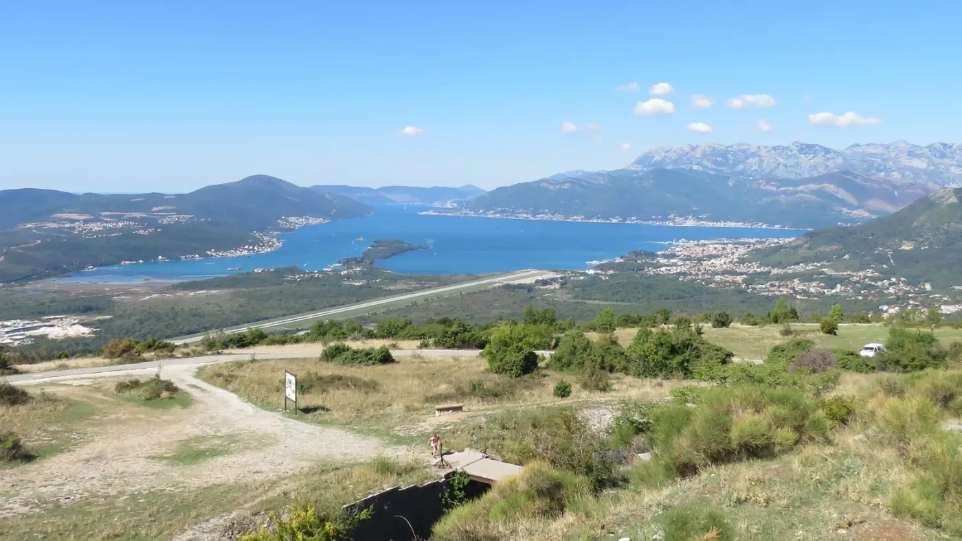 Aerial view over Tivat Bay with the airport runway below and mountains behind, seen from Fort Gorazda in Montenegro