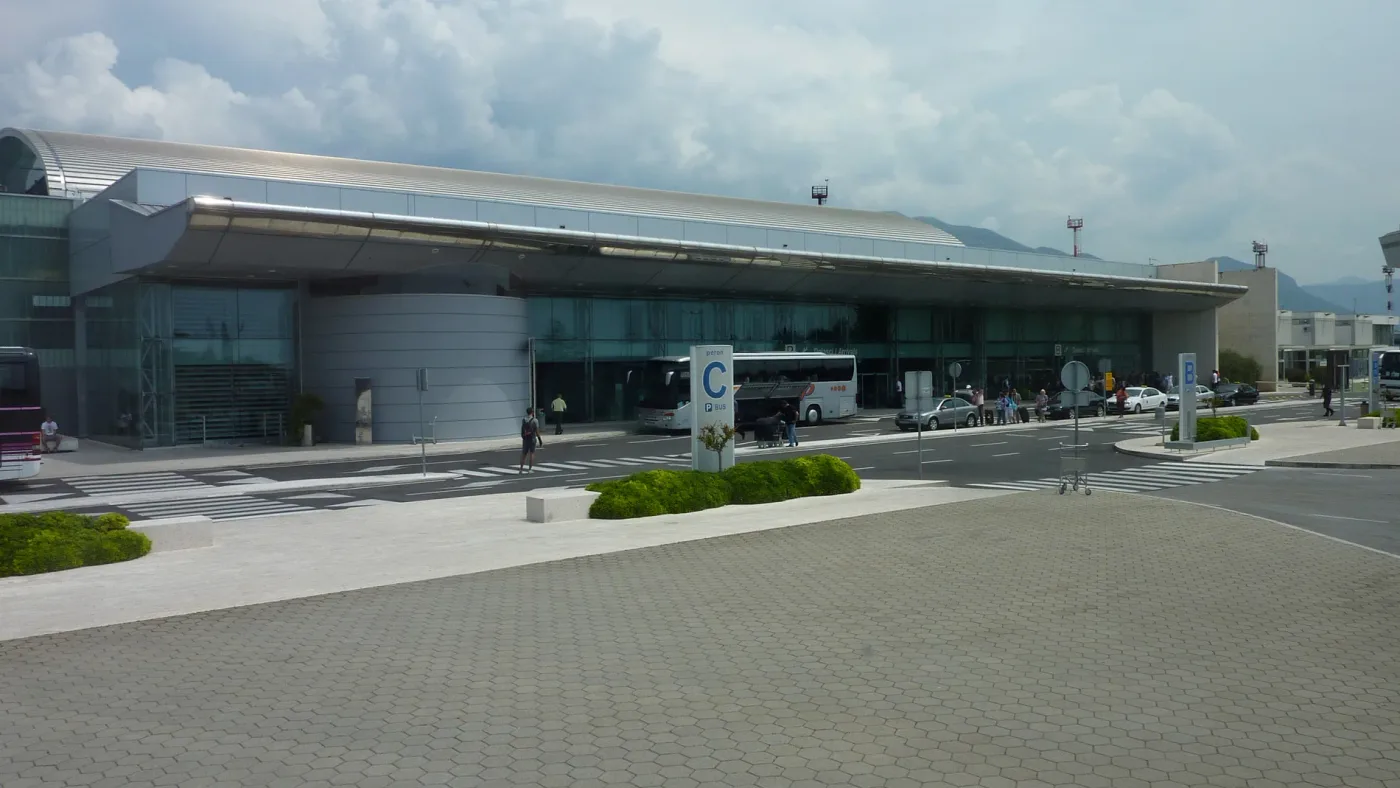 The terminal building at Dubrovnik Airport, with coaches and taxis waiting outside the arrivals doors
