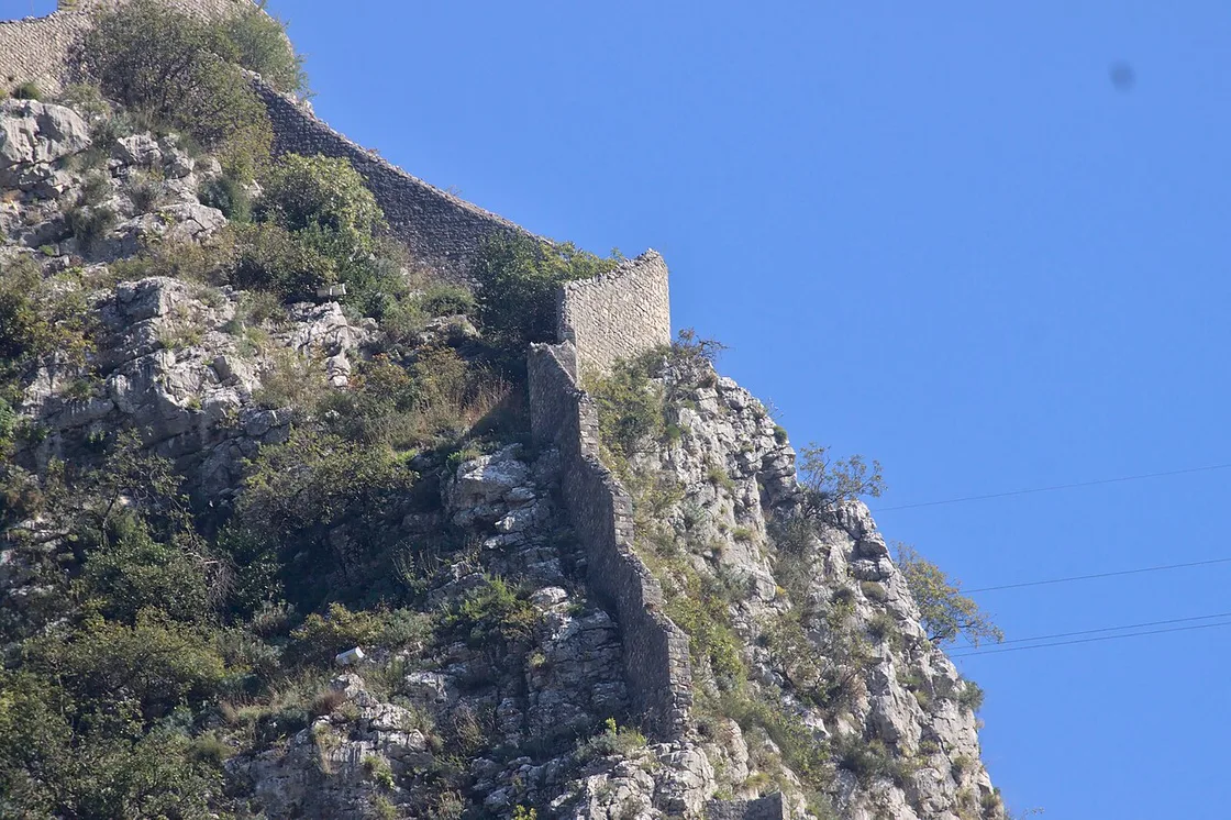 Kotor's stone city walls zig-zagging up the steep mountainside above the Old Town