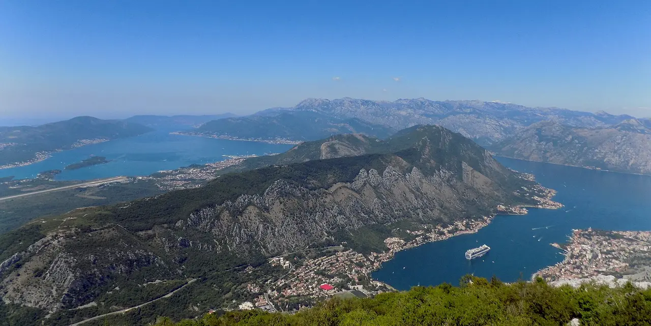 Aerial view of the Bay of Kotor with a cruise ship sailing through the inner bay, Montenegro