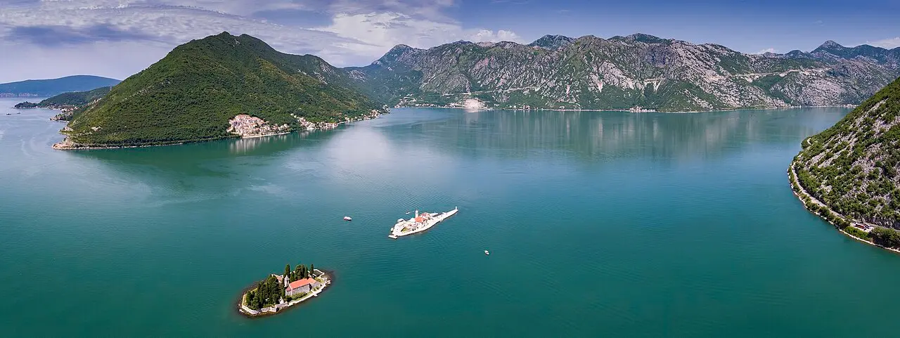 Aerial view of Perast and its two islets in the Bay of Kotor, the church of Our Lady of the Rocks on the water