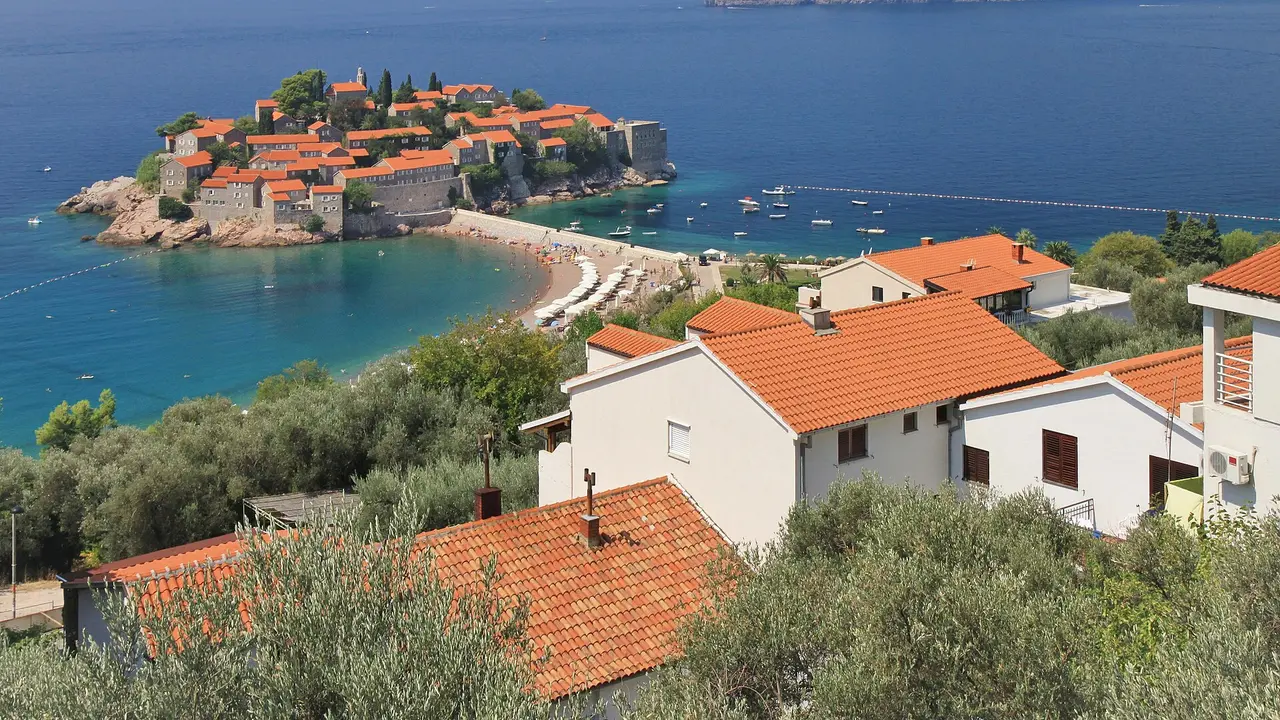 The fortified islet of Sveti Stefan on its causeway, the Montenegrin coast and the Adriatic behind
