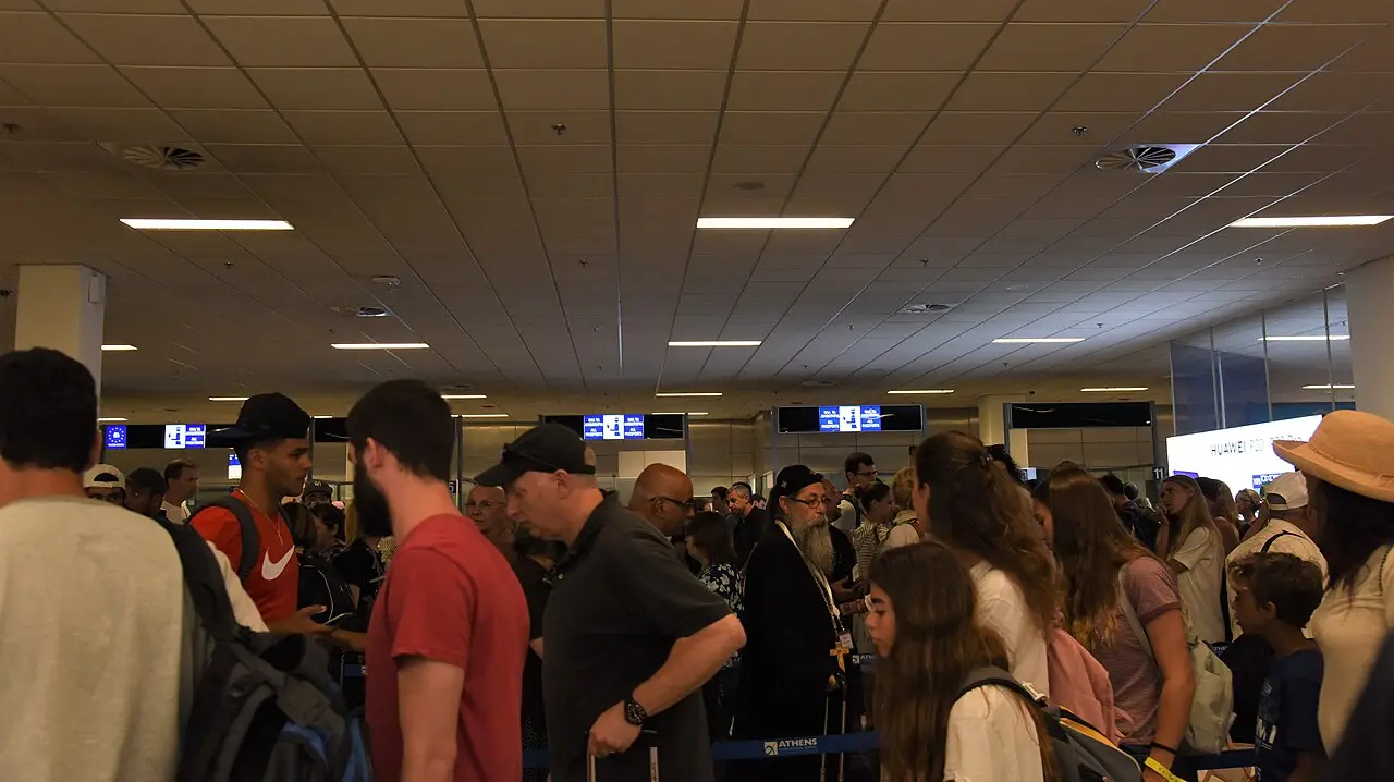 Travellers queuing at airport passport control, illustrating Montenegro entry requirements
