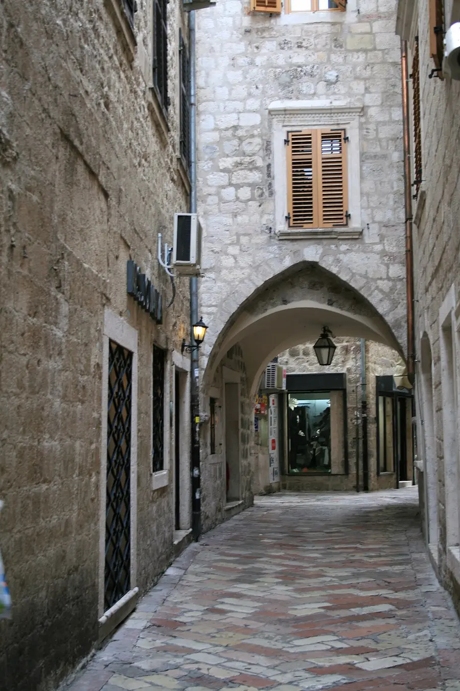 A quiet, empty stone lane in the old town of Kotor, Montenegro