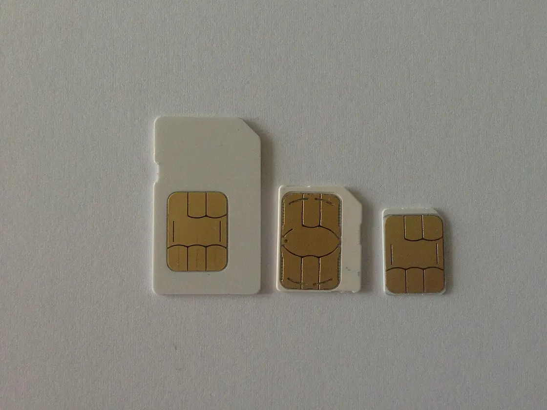 Mini, micro and nano SIM cards still attached to a plastic punch-out sheet