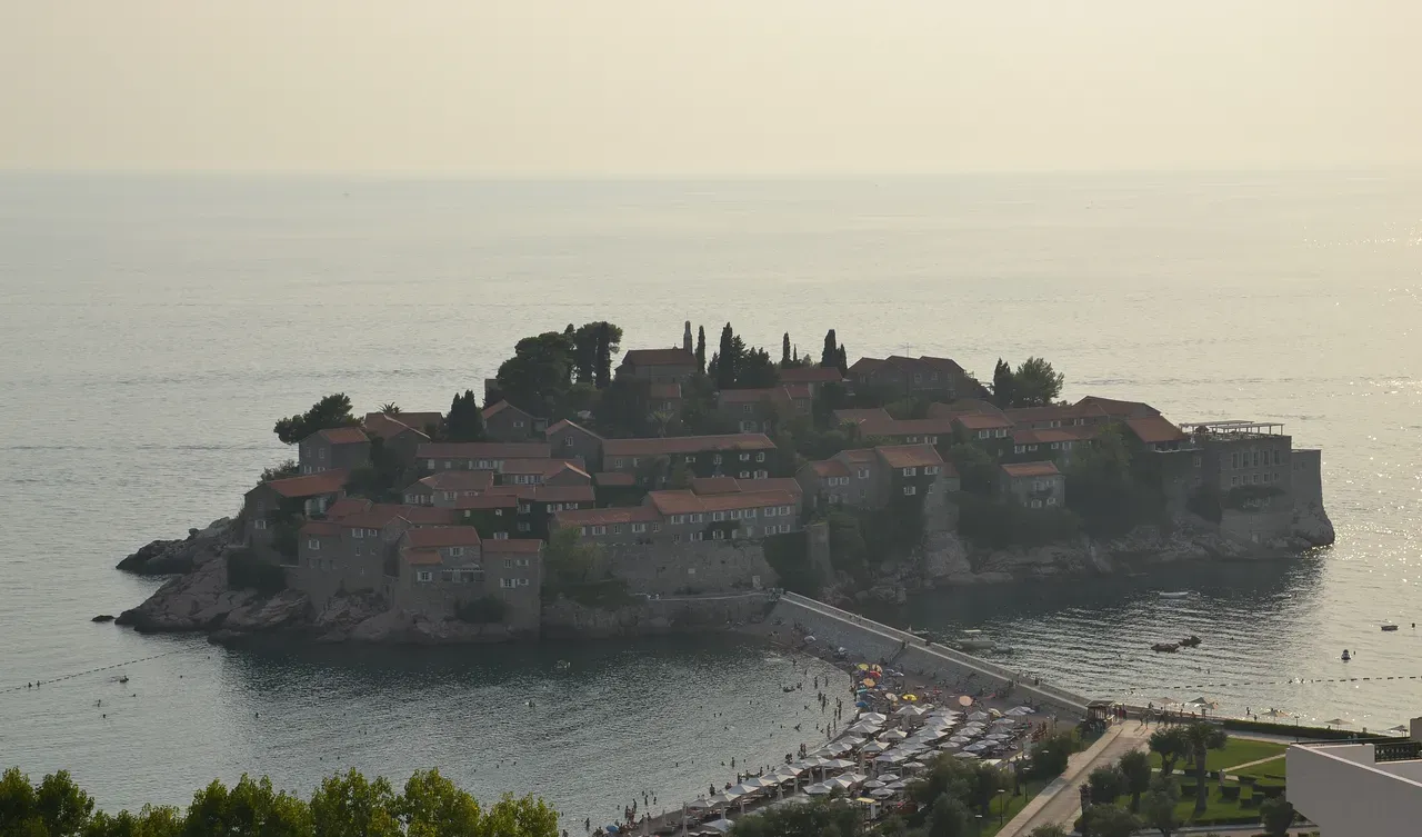 The islet resort of Sveti Stefan connected to the Montenegrin coast by a narrow isthmus