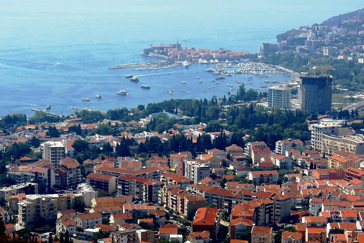 Panorama of Budva on the Montenegrin coast, its old town and marina on a small peninsula backed by mountains