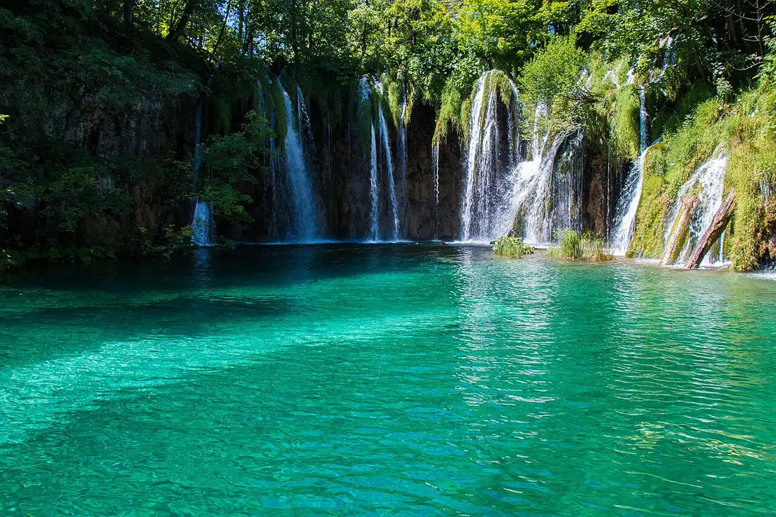 Turquoise pools and wooden walkways among the waterfalls of Plitvice Lakes National Park in Croatia
