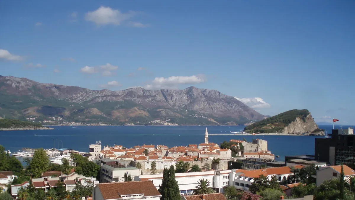 Budva old town, its marina and the island of Sveti Nikola seen from the Gospoština hillside above the coast, Montenegro