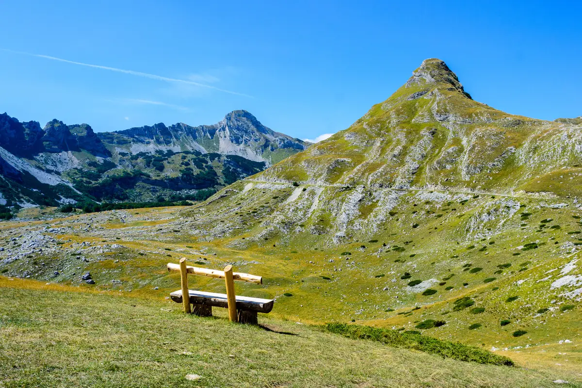 Green alpine meadows and grey limestone peaks of Durmitor National Park in northern Montenegro