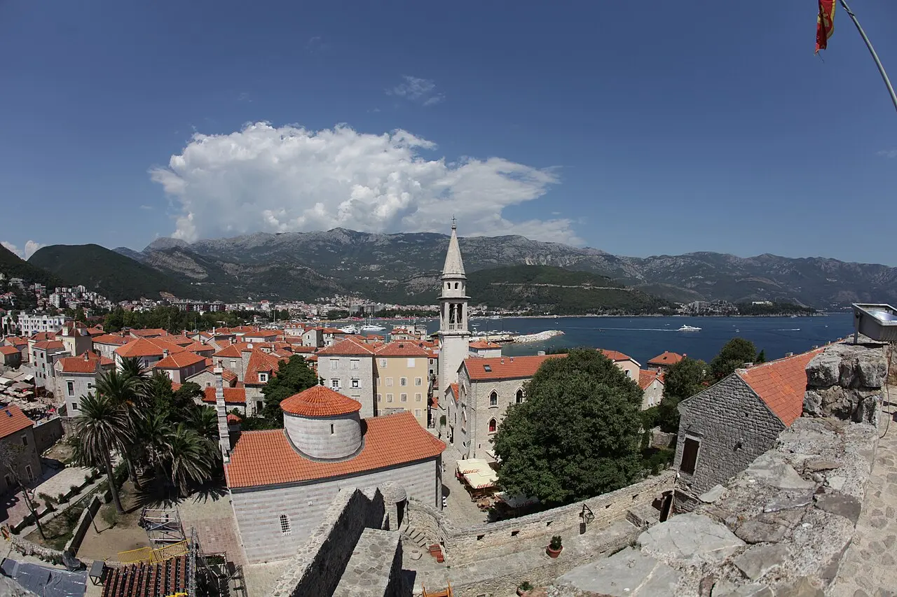 Budva old town rooftops, the church bell tower and the sea seen from the citadel walls