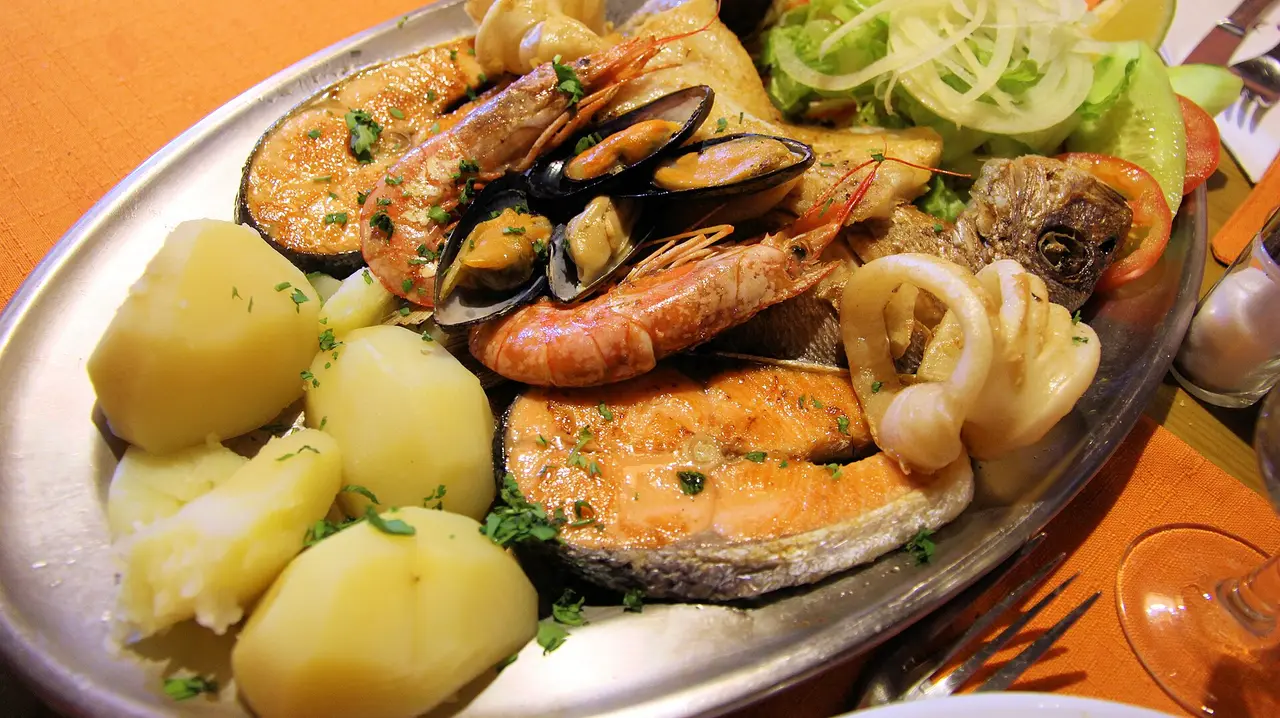 A mixed seafood grill platter with fish, prawns, mussels and squid