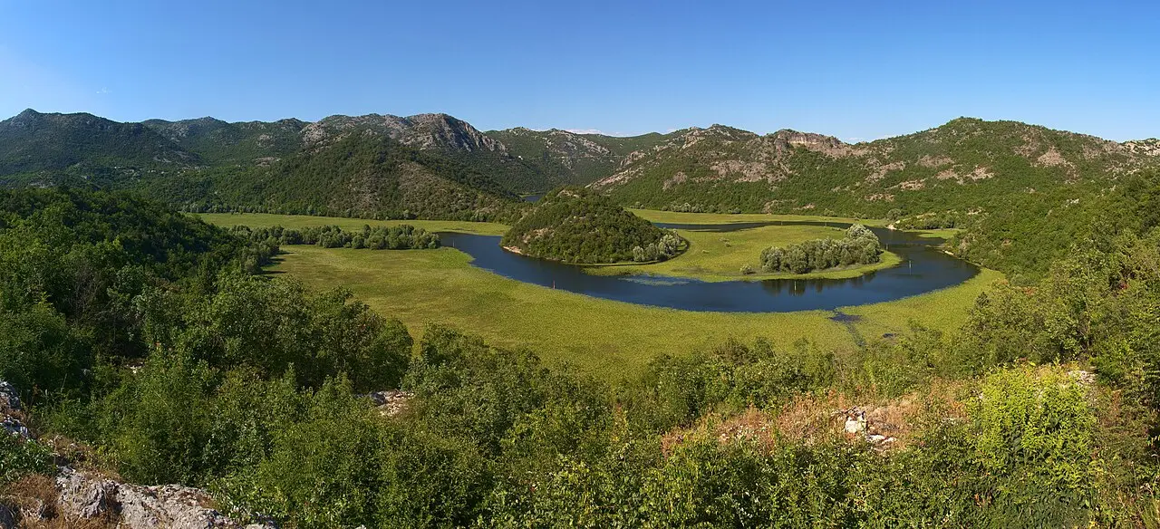 Panoramic view of the horseshoe bend of the Crnojević River from the Pavlova Strana viewpoint above the village