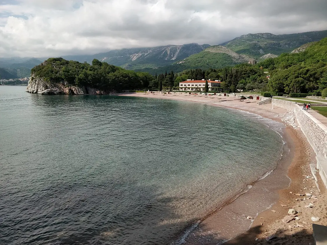 Villa Milocer, the former royal summer residence, above its pink-sand beach and cypresses near Sveti Stefan