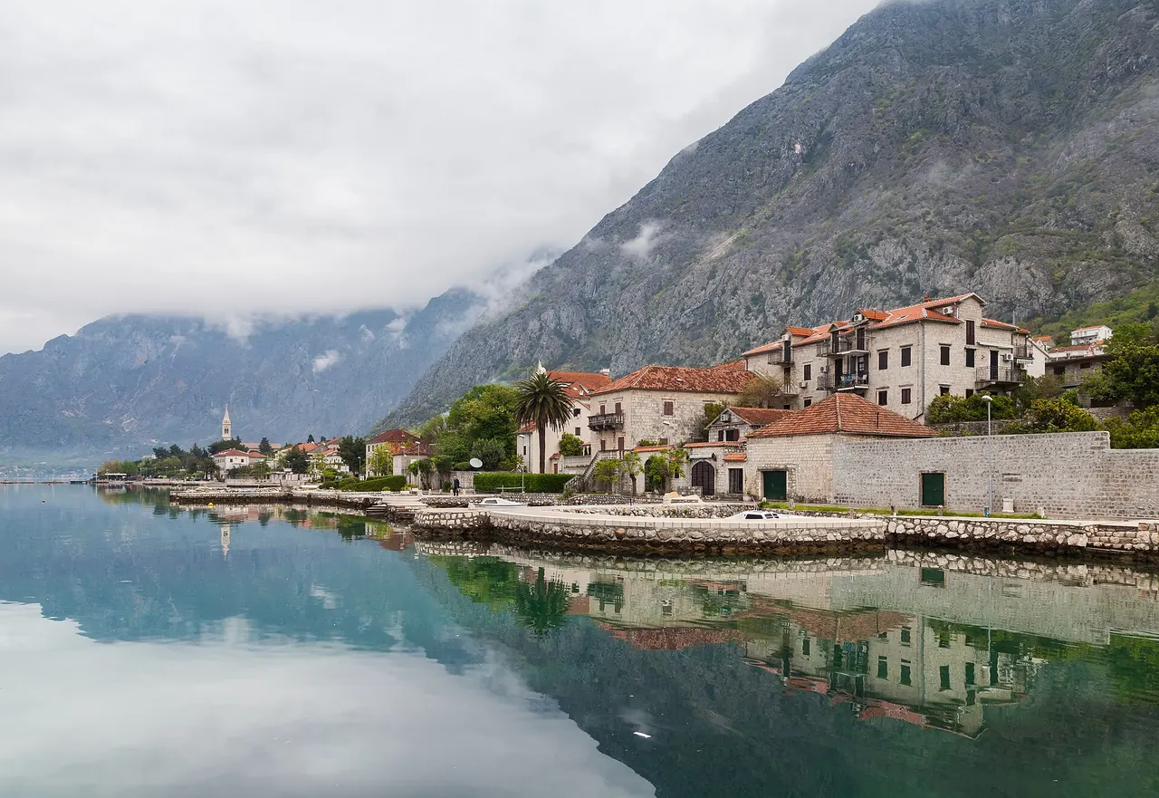 Stone houses and boats along the Dobrota shore of the Bay of Kotor