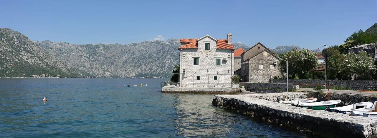 Shoreline settlement of Stoliv along the Bay of Kotor under steep mountains