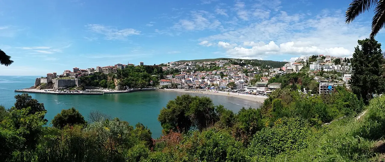 Panorama of Ulcinj with the walled Old Town on its rocky point above Mala Plaža and the town rising behind, Montenegro