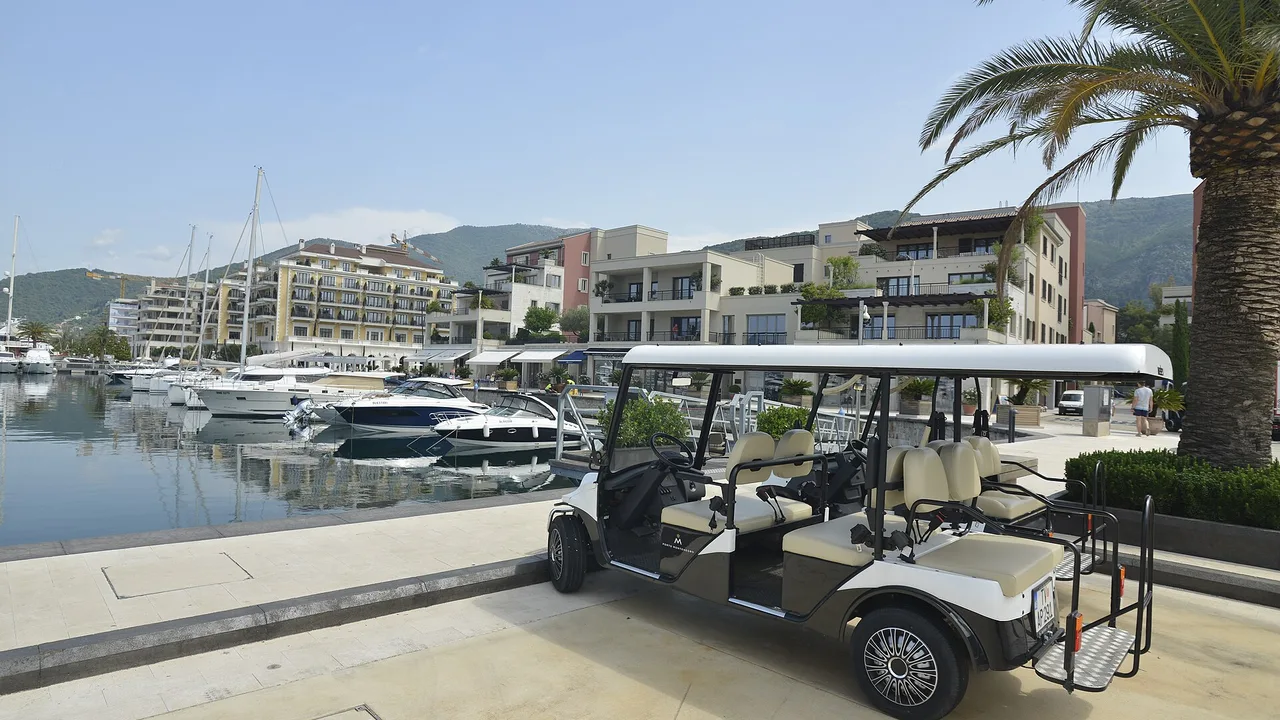 Superyachts and marina buildings along the Porto Montenegro waterfront in Tivat